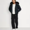 Unisex bomberjakke for barn med original shearling-kant